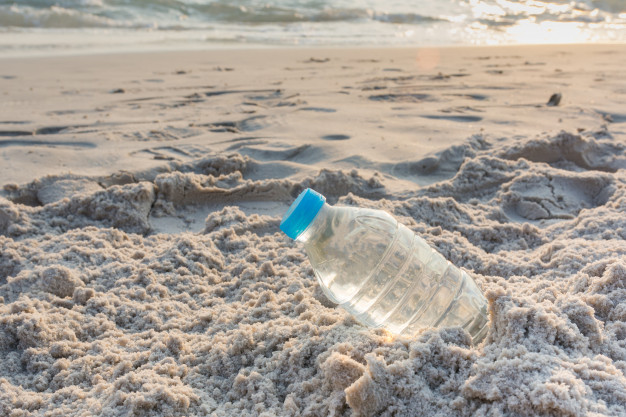 plastic-bottle-on-the-beach_39148-34